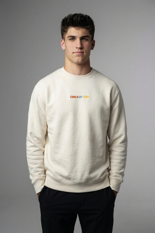 Man wearing bone crewneck sweatshirt with 'CHILD OF GOD' embroidery on front